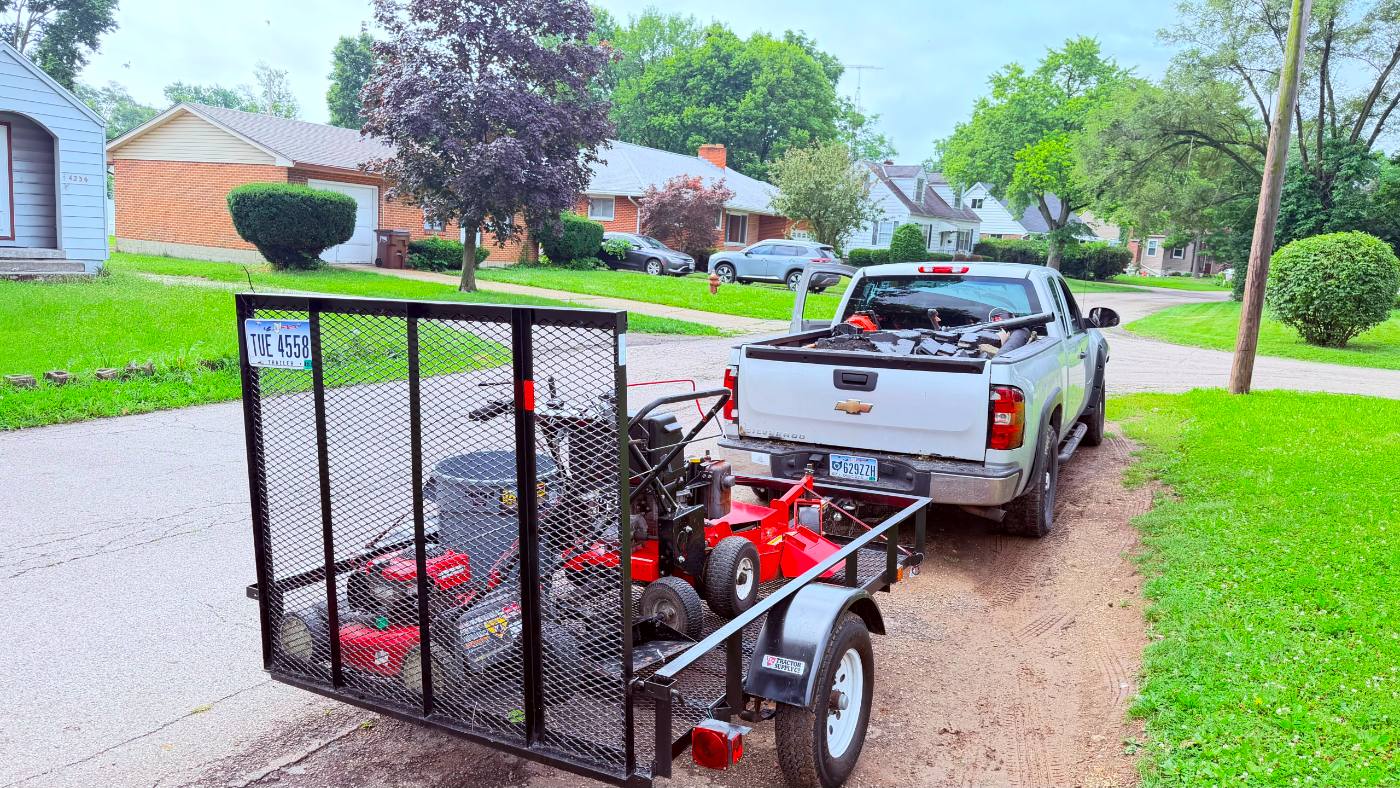 Gaby Lawn Care Services truck and professional lawn equipment trailer ready for service